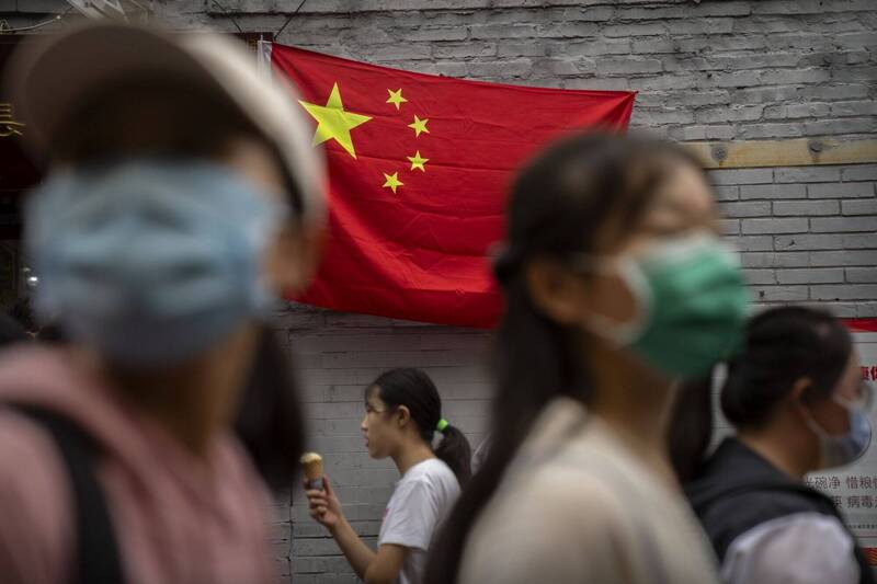 一个人可能一辈子都没有参与任何情报活动，但当他走出中国国境，他与中国国家情报体系之间的那条法律连线，并不因此消失；示意图。（美联社档案照）
